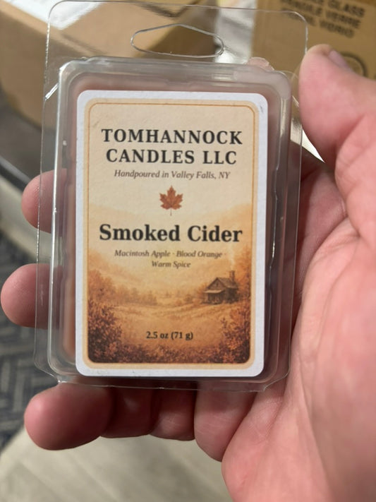 Smoked Cider wax melt in labeled 2.5 oz clamshell packaging